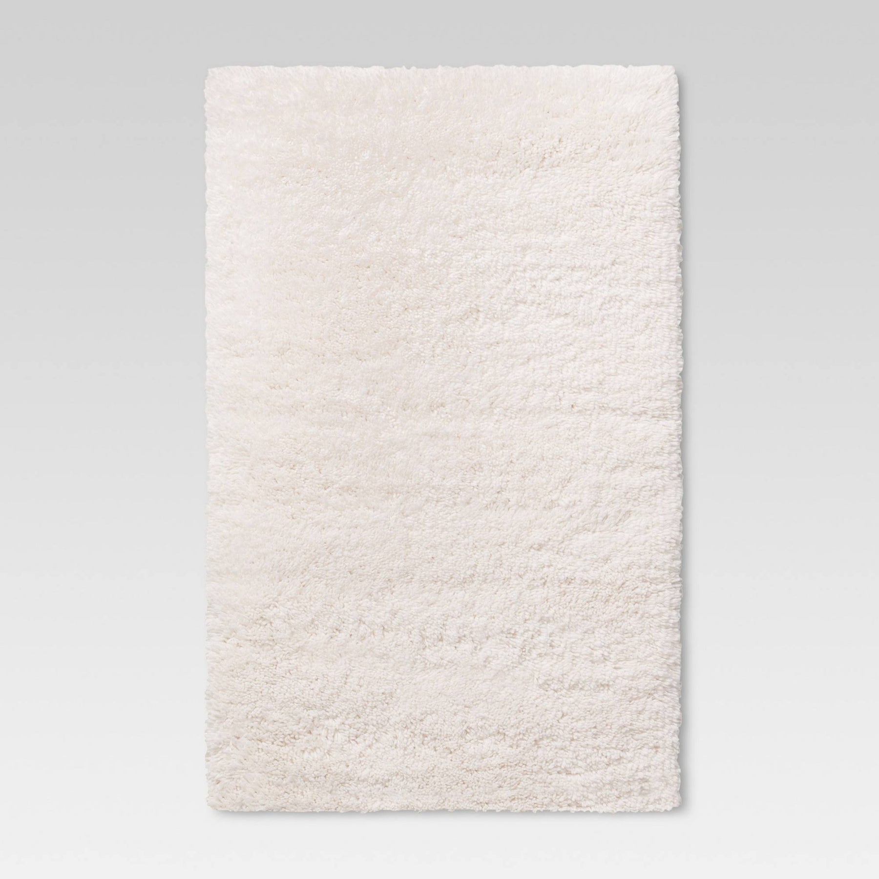 4'x5'6" Cream Plush Shag Washable Accent Rug - Room Essentials